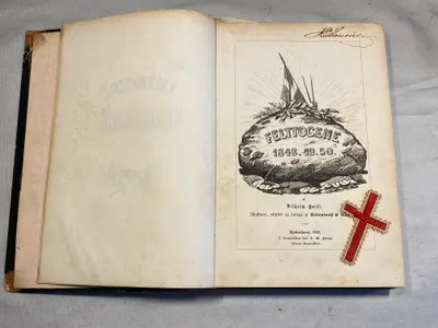 Sjælden original bog fra 1852 -  Felttogene 1848.49.50 med lille stofkors