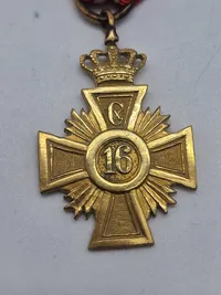 Originalt Hæderstegn for 16 års tro tjeneste for underofficerer. Hæderstegnet er indført 12/1 1854