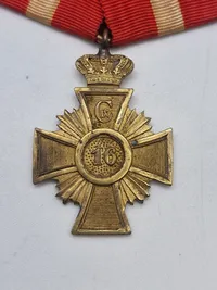 Originalt Hæderstegn for 16 års tro tjeneste for underofficerer. Hæderstegnet er indført 12/1 1854