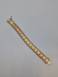 Armbånd tungt og stemplet men er i Tvivl om det er guld