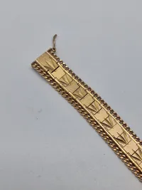 Armbånd tungt og stemplet men er i Tvivl om det er guld