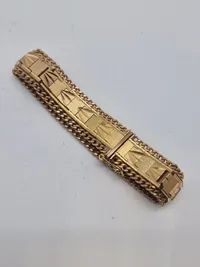 Armbånd tungt og stemplet men er i Tvivl om det er guld