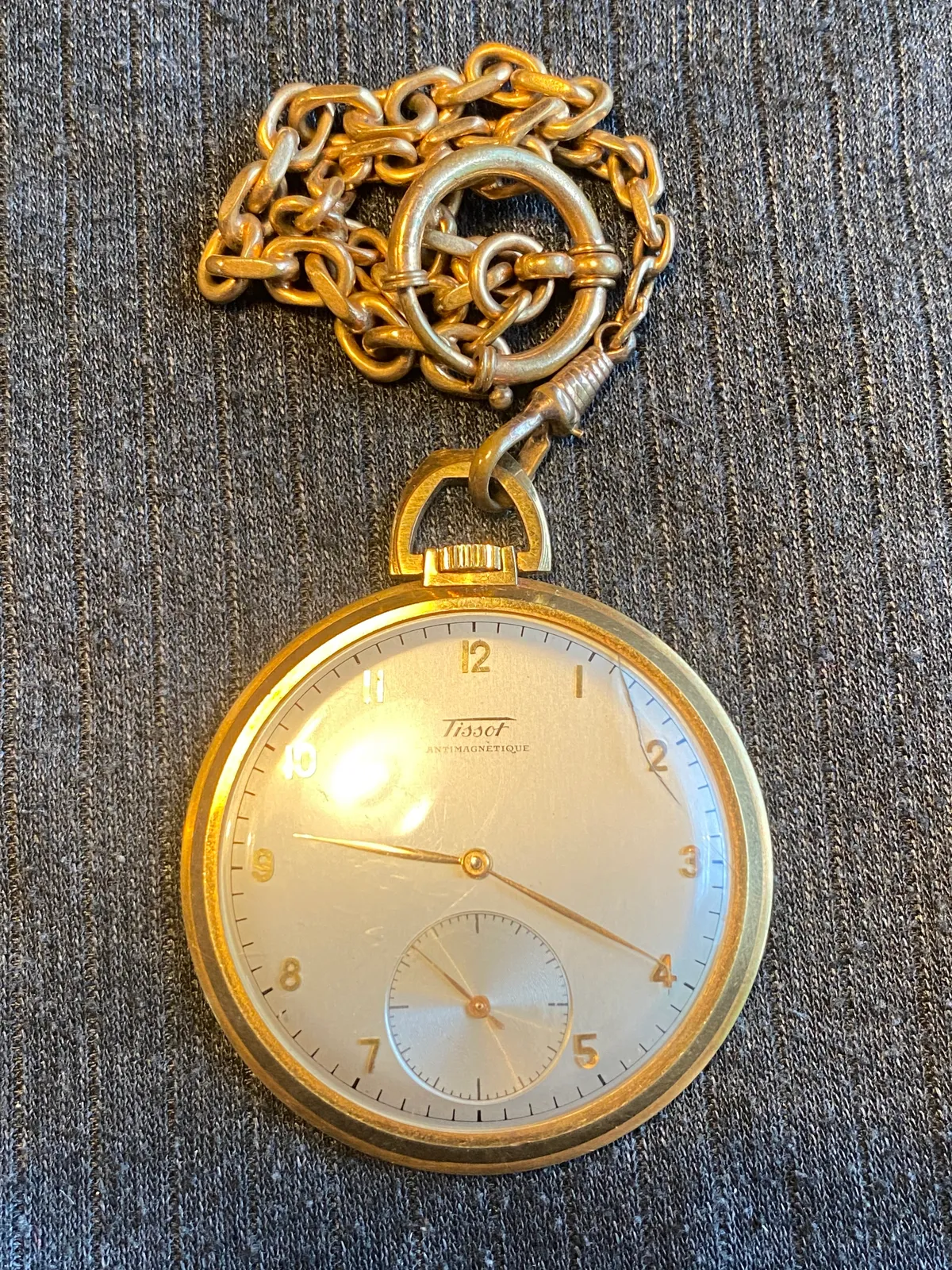 Tissot lommeur med bagkasse af 18 karat guld (bagkasse vejer ca 3 gram)