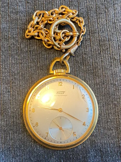 Tissot lommeur med bagkasse af 18 karat guld (bagkasse vejer ca 3 gram)
