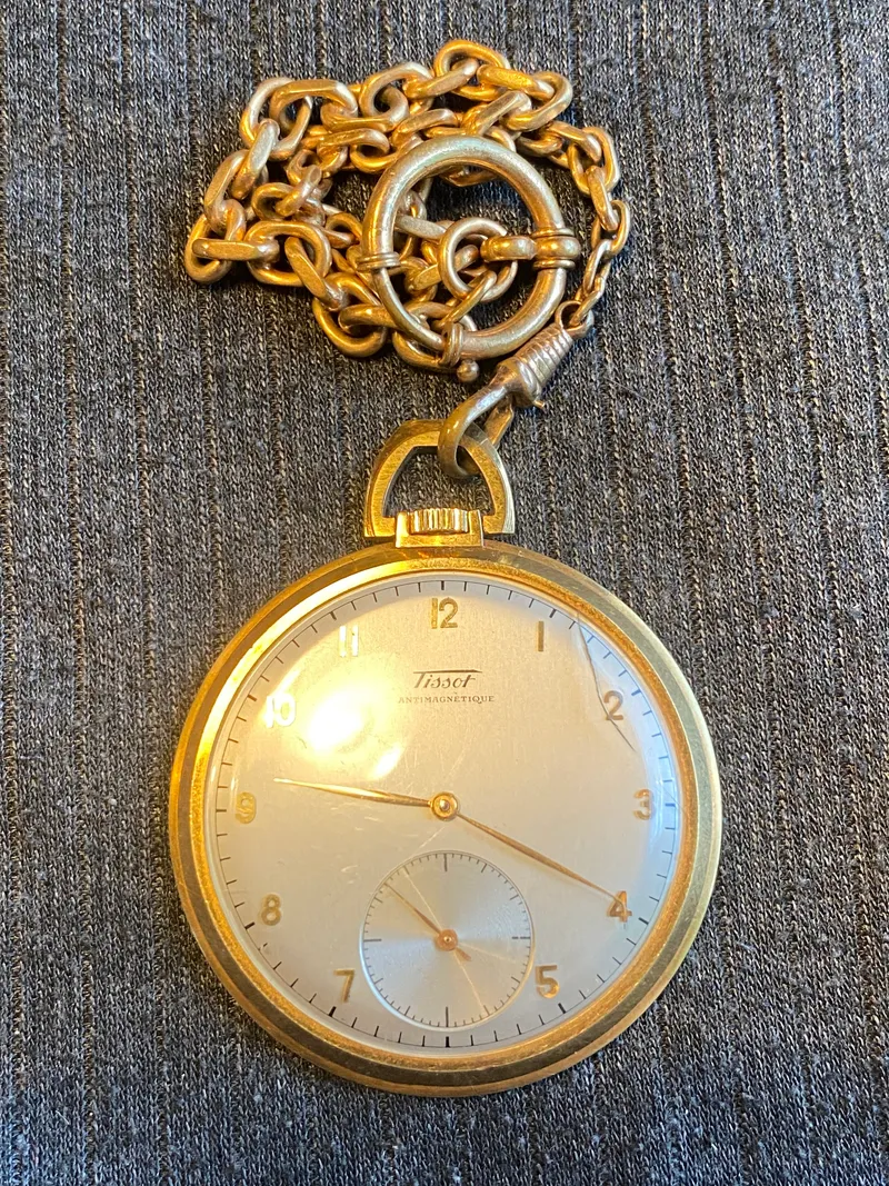 Tissot lommeur med bagkasse af 18 karat guld (bagkasse vejer ca 3 gram)