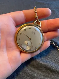Tissot lommeur med bagkasse af 18 karat guld (bagkasse vejer ca 3 gram)