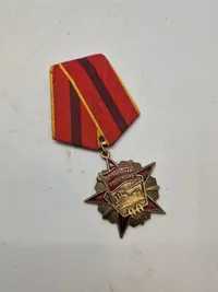 USSR - OCTOBER REVOLUTION MEDAL WITH AURORA CRUISER