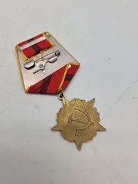 USSR - OCTOBER REVOLUTION MEDAL WITH AURORA CRUISER
