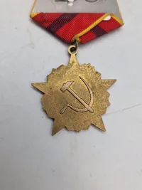 USSR - OCTOBER REVOLUTION MEDAL WITH AURORA CRUISER