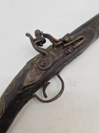 Deko pistol med økse i enden