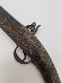 Deko pistol med økse i enden