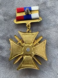 RUSSIAN FEDERATION MEDAL. RED CROSS FOR SERVICE IN THE CAUCASUS EAGLE WITH RIFLES 1st. class