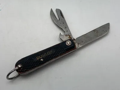 Original kniv med reklame for Dunlop