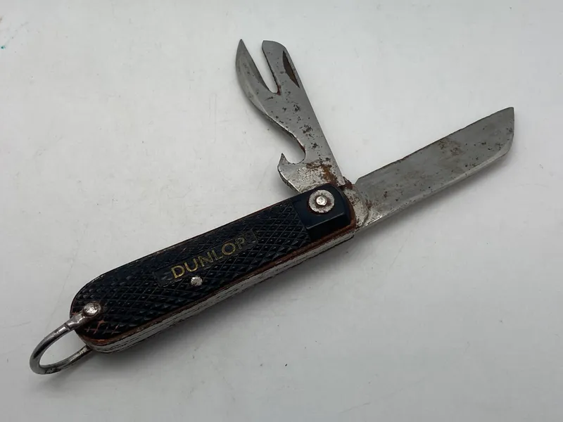 Original kniv med reklame for Dunlop