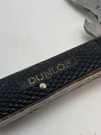 Original kniv med reklame for Dunlop