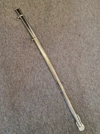 Fin velholdt dansk sabel M/1950 med fæste af forsølvet  tombak.
Skede er forkromet stål