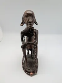Collection of Four Hand-Carved African Ebony Wood Sculptures and Utensil