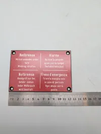 Vintage skilt med Nødbremse-instruktioner på fire sprog DSB