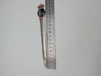 Dansk brevåbner i metal med emaljeret Kongeriget Danmark emblem