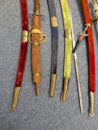 Collection of Nine Assorted Ceremonial Swords, Sabers, and Daggers