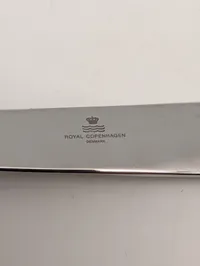 Georg Jensen og Royal Copenhagen brevåbner og flaskeåbner i rustfrit stål