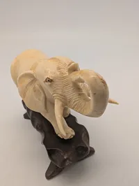 Vintage Carved Faux-Ivory Elephant Figurine on Wooden Stand
