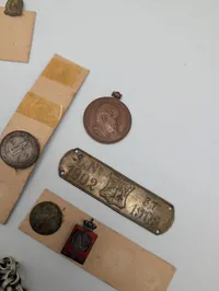 Collection of Vintage Danish Military and Commemorative Medals, Pins, and Coins
