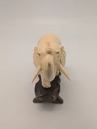 Vintage Carved Faux-Ivory Elephant Figurine on Wooden Stand