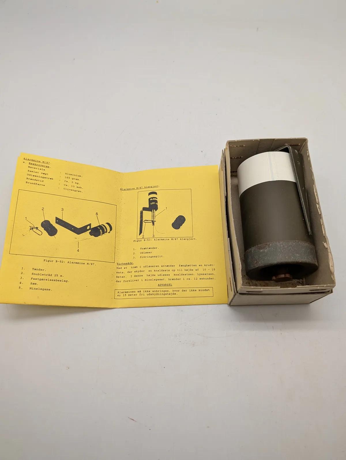 HMAK Alarmblus M/62 med tilhørende manual til Alarmmine M/87