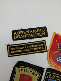 Samling af 7 danske brandvæsen- og ambulance-stofmærker