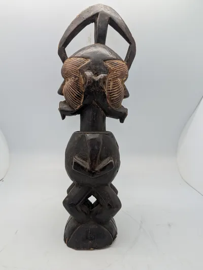 West African Hand-Carved Janus-Faced Wooden Figural Sculpture
