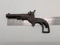 Antik støbejerns legetøjspistol med patentdatoer fra 1887