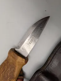 Helle Norway Stainless Steel Fixed Blade Knife with Curly Birch Handle