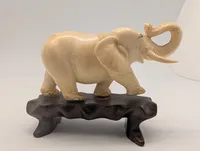 Vintage Carved Faux-Ivory Elephant Figurine on Wooden Stand