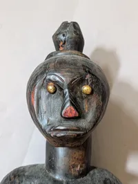 African Carved Dark Wood Fertility Figure with Brass Eye Inlays