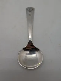 Georg Jensen jubilæumsske i sterlingsølv, designet af Henning Koppel