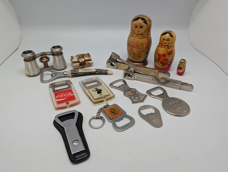 Vintage Collectibles Lot including Coca-Cola Openers and Matryoshka Dolls