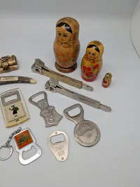 Vintage Collectibles Lot including Coca-Cola Openers and Matryoshka Dolls