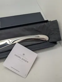 Georg Jensen Indulgence champagnesabel designet af Helle Damkjær