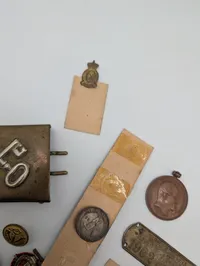 Collection of Vintage Danish Military and Commemorative Medals, Pins, and Coins
