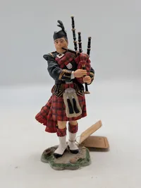 Skotsk Sækkepibespiller Figur i Traditionel Kilt