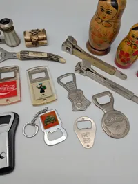 Vintage Collectibles Lot including Coca-Cola Openers and Matryoshka Dolls