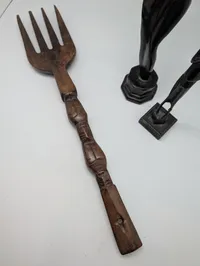 Collection of Four Hand-Carved African Ebony Wood Sculptures and Utensil