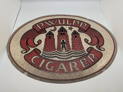 P. Wulff Cigarer ovalt skilt med byvåben