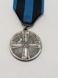 Finsk Frihedskrigs Mindemedalje 1918 med originalt bånd