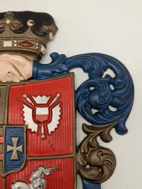 Støbejernsvåbenskjold med Slesvig-Holsten motiv og motto