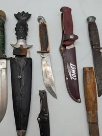 Collection of Eight Vintage Fixed Blade and Folding Knives