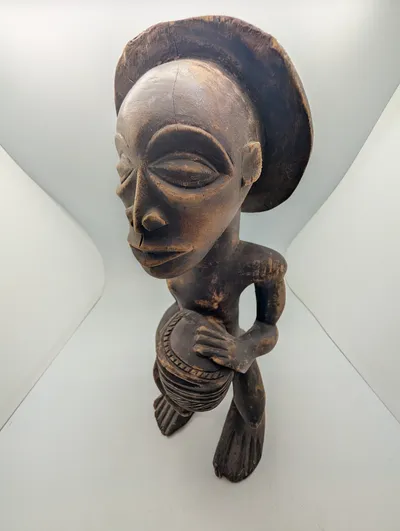 Hand-Carved African Wood Sculpture of a Drummer with Traditional Headdress