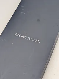 Georg Jensen Indulgence champagnesabel designet af Helle Damkjær