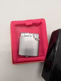 To vintage lightere fra Silver Match og Colibri